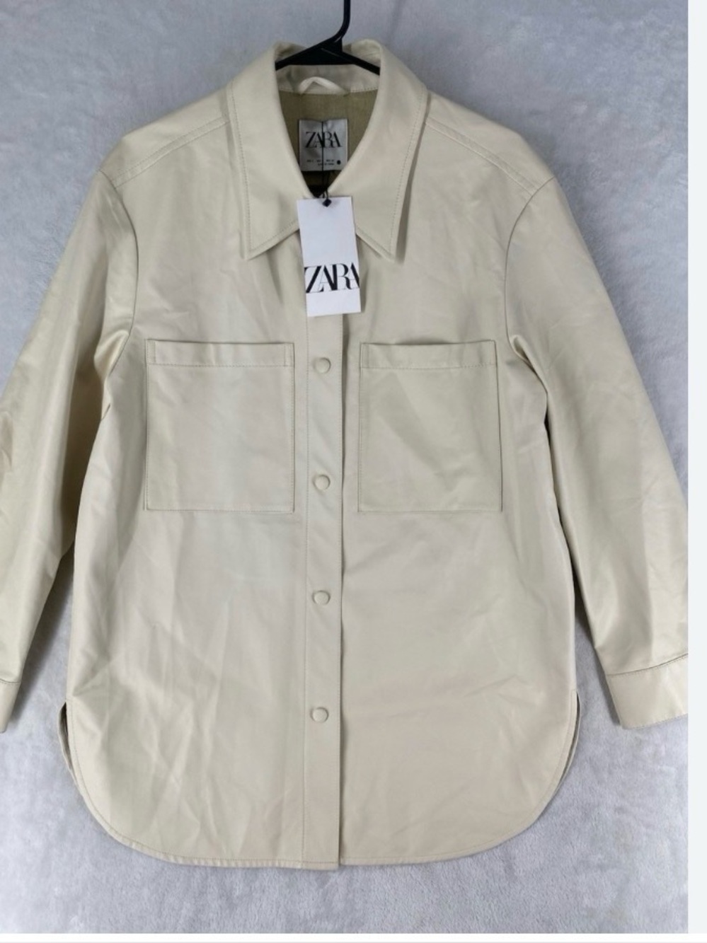 Zara Cream Button-Front Leather Shirt Jacket retails for 70$